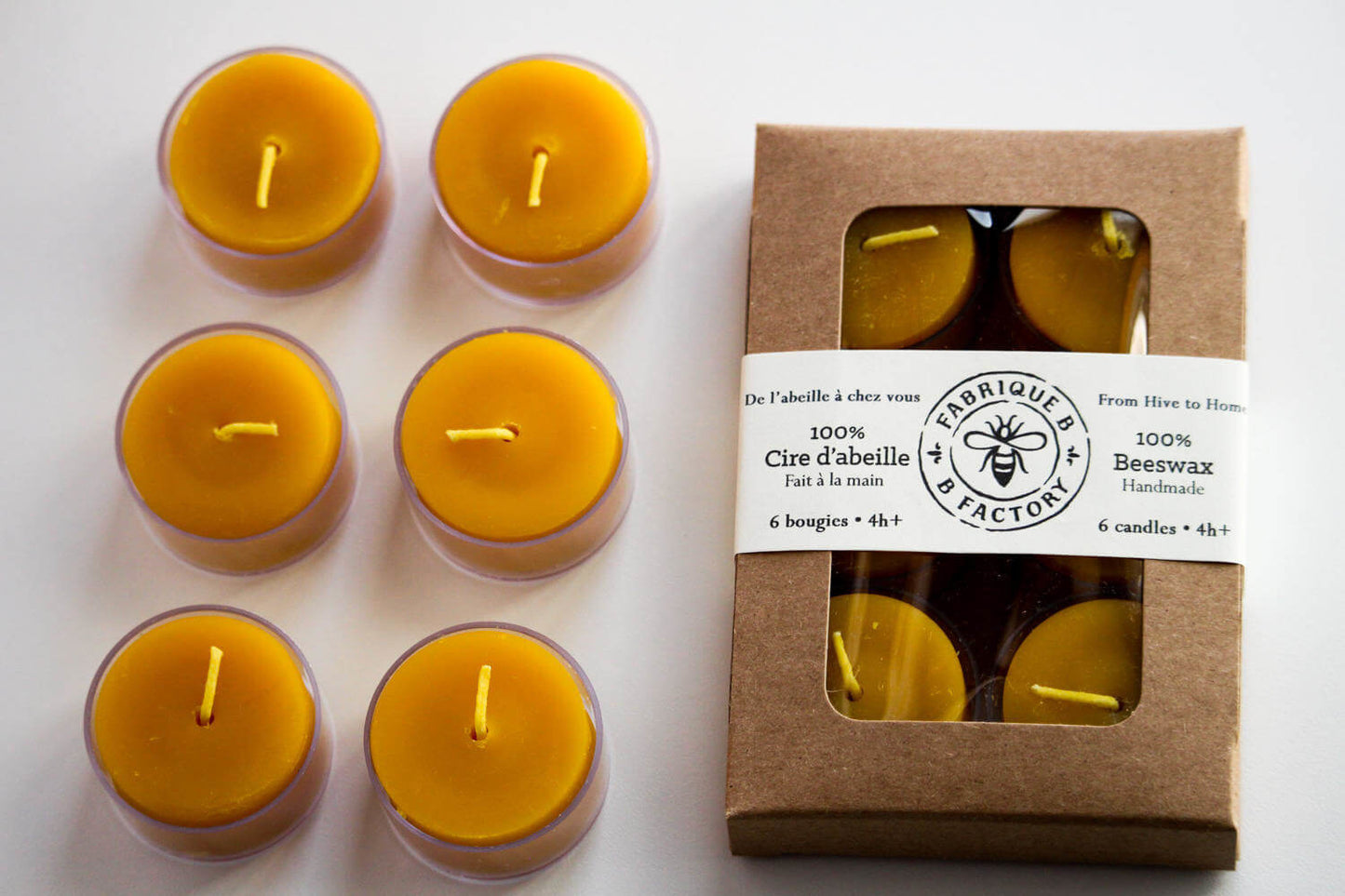 6 beeswax tea light candles next to set of 6 beeswax tea light candles in gift box with B Factory logo on lid