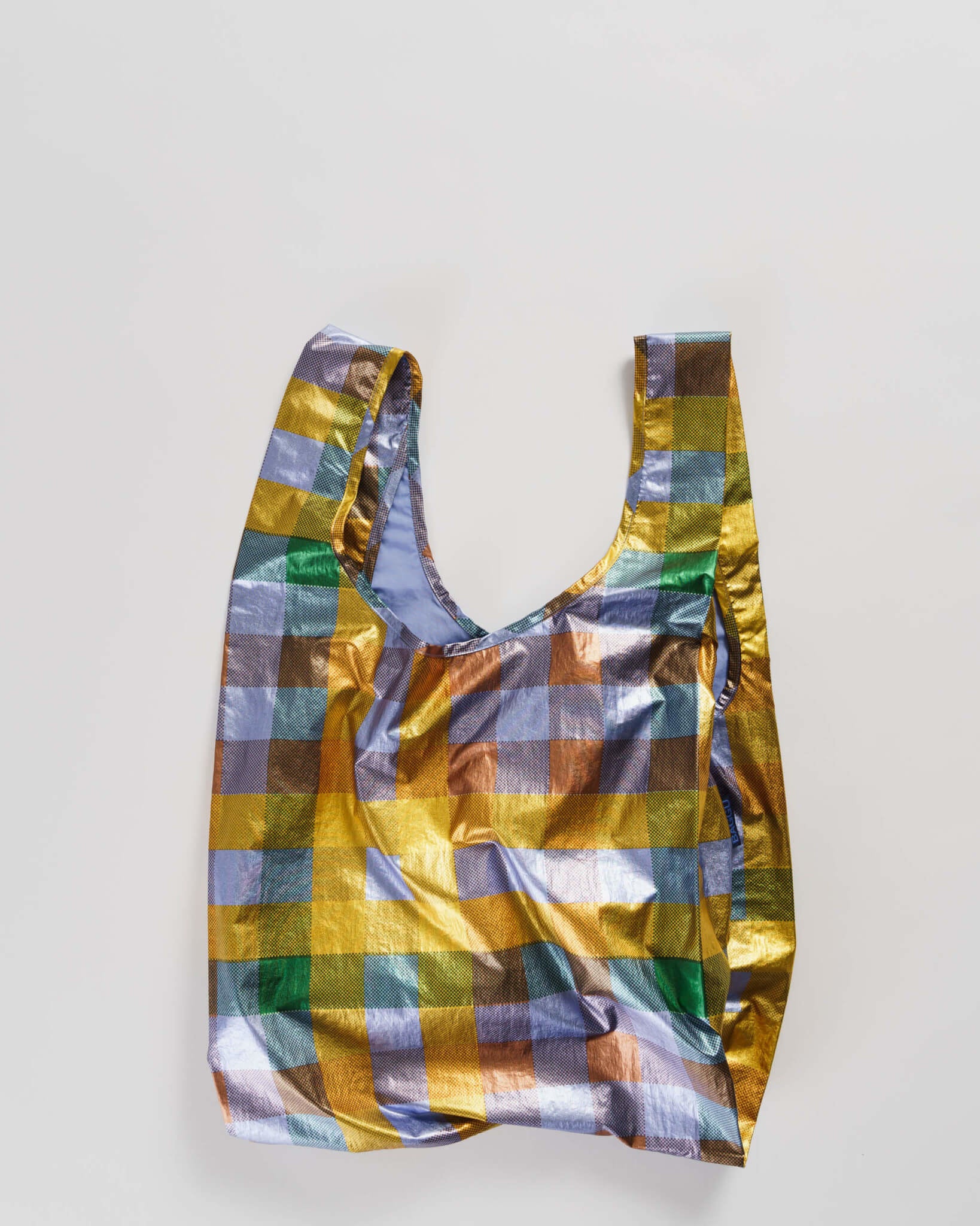 Reusable shopping bag with metallic plaid pattern